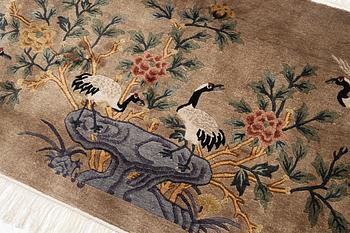 A silke figural rug, China, later part of the 20th century, ca. 92 x 170 cm.