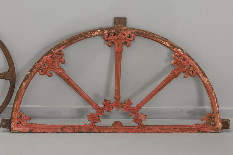 A SET OF THREE CAST IRON WINDOWS.