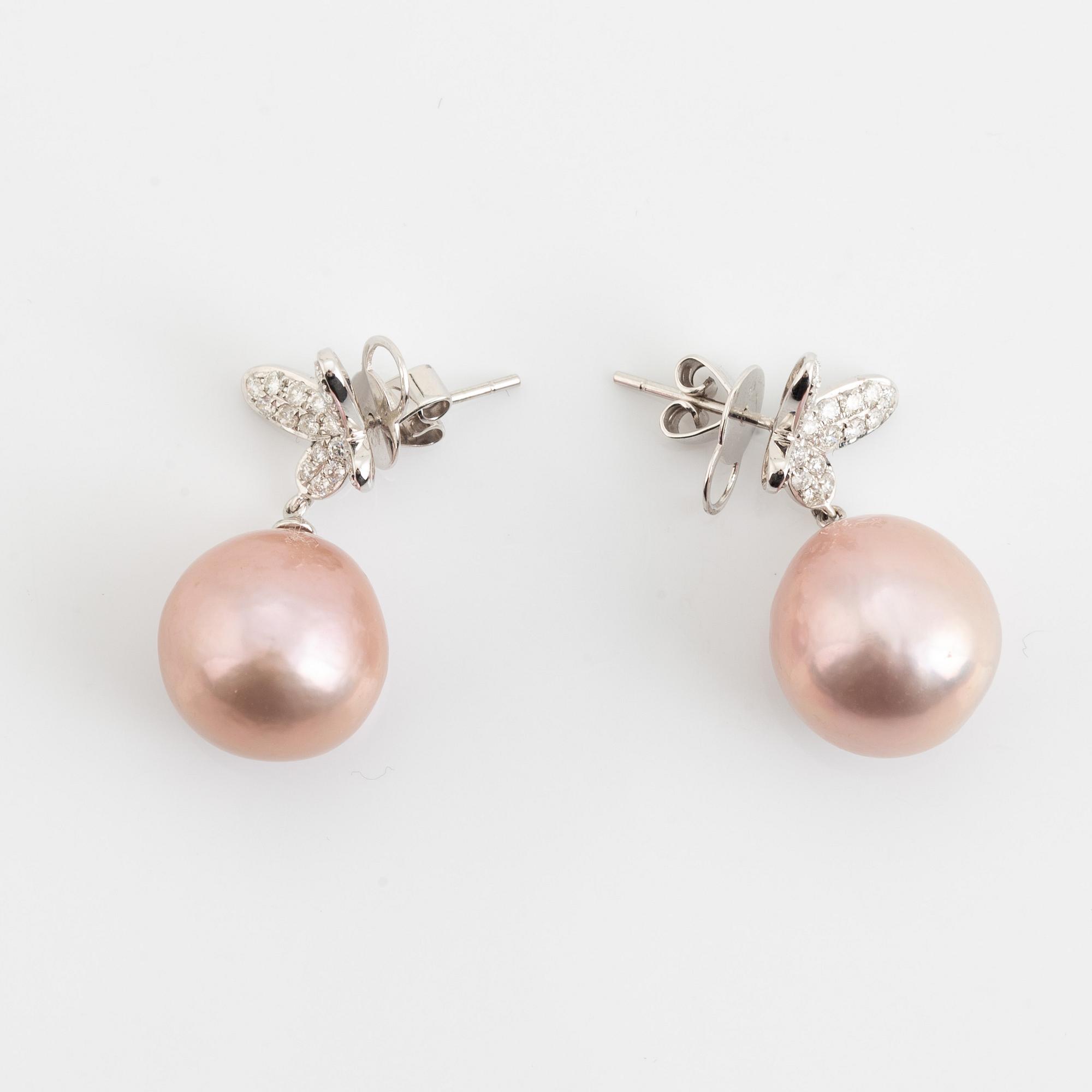Pink freshwater pearl and brilliant cut diamond butterfly earrings.