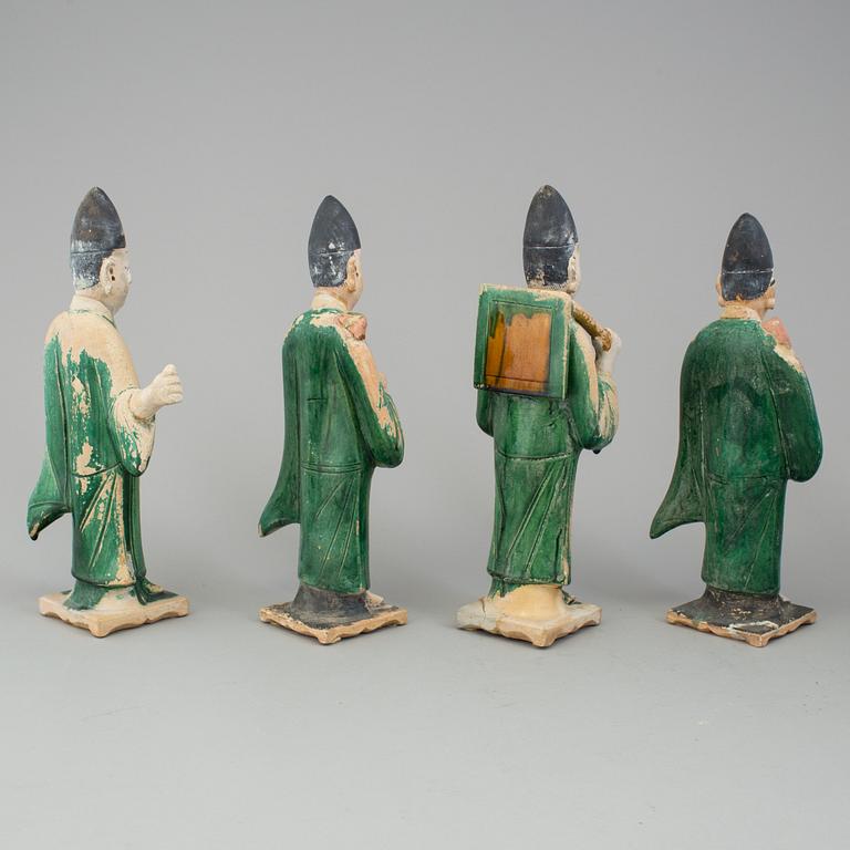 A group of eight chinese figures with three objects, earthenware, Ming dynasty.