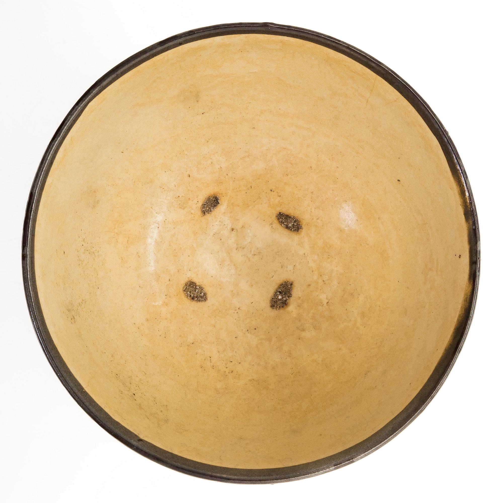 A creme glazed bowl, presumably Song/Yuan dynasty.