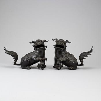 Two bronze figures of a buddhist lion, late Qing.