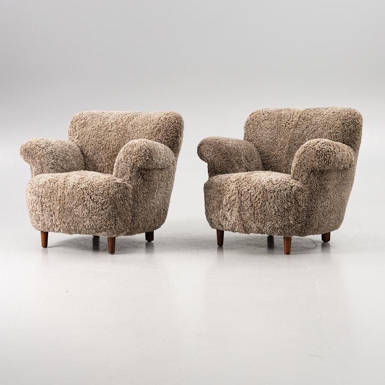 A pair of easy chairs, mid-20th century.