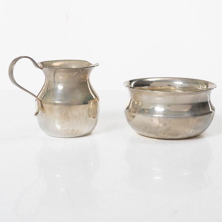 a silver creamer and sugar bowl, designed by Christian, Gewe Silvervarufabriken Ab, Malmö, Sweden, 1974-75.