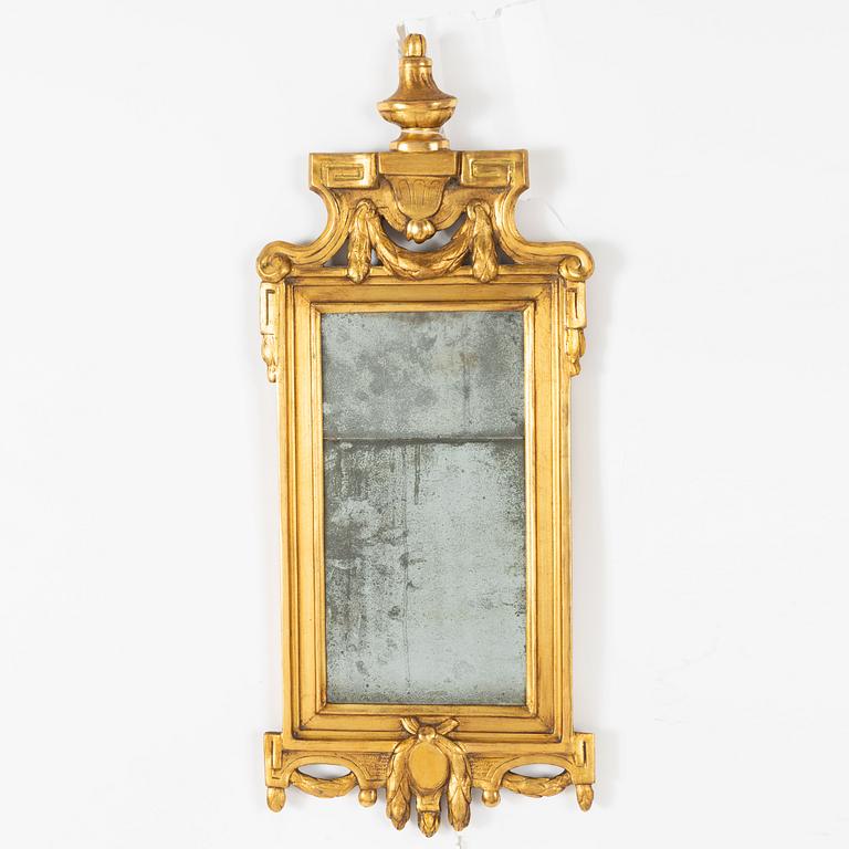 A Gustavian giltwood mirror by C. G. Fyrwald (master in Stockholm 1776-1825).