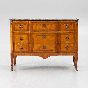A Louis XVI style chest of drawers, France, circa 1900.