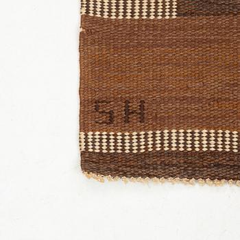 A carpet, flat weave and tapestry weave, signed SH (Svensk hemslöjd) 229 x 154 cm.