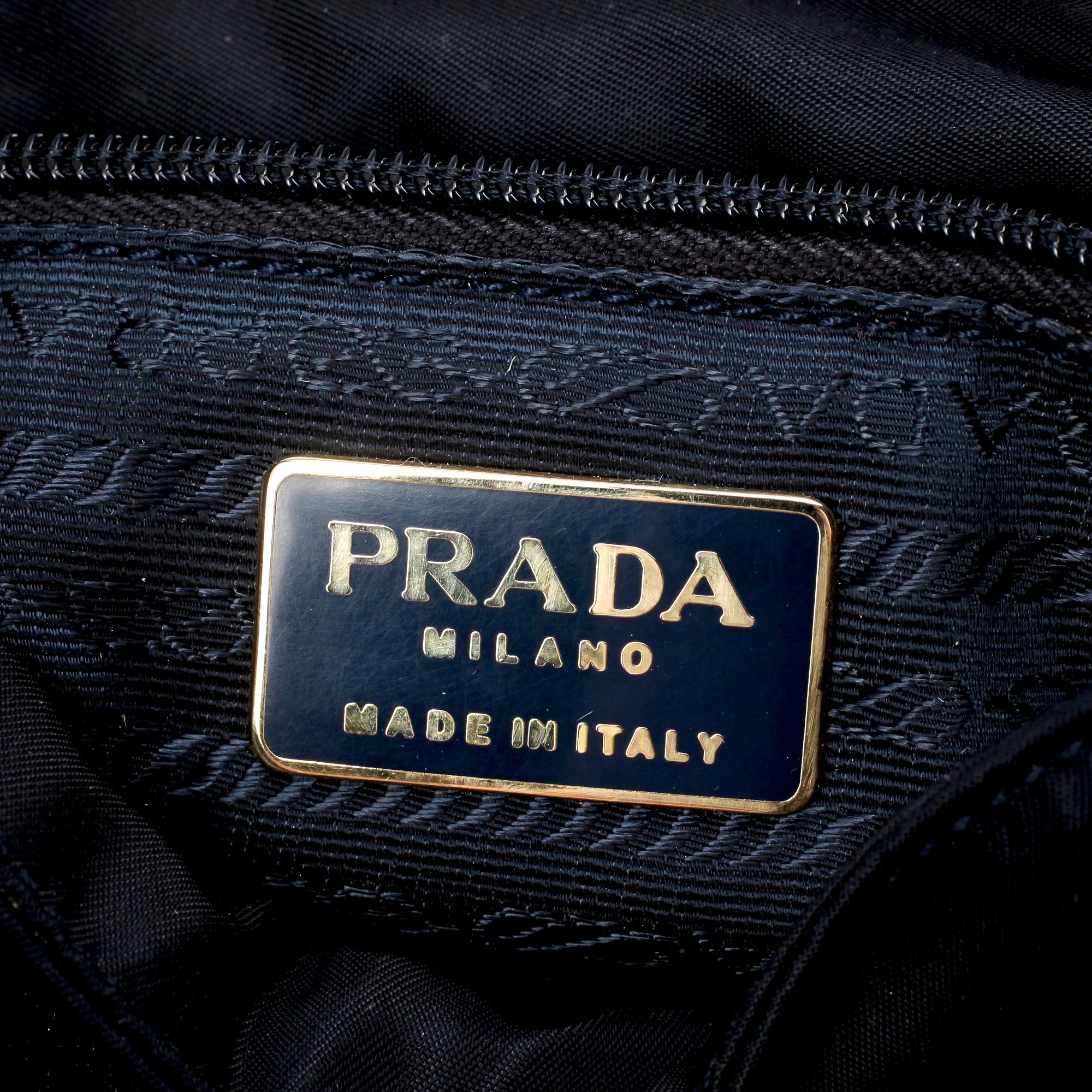 PRADA, a blue nylon and leather shoulder bag.
