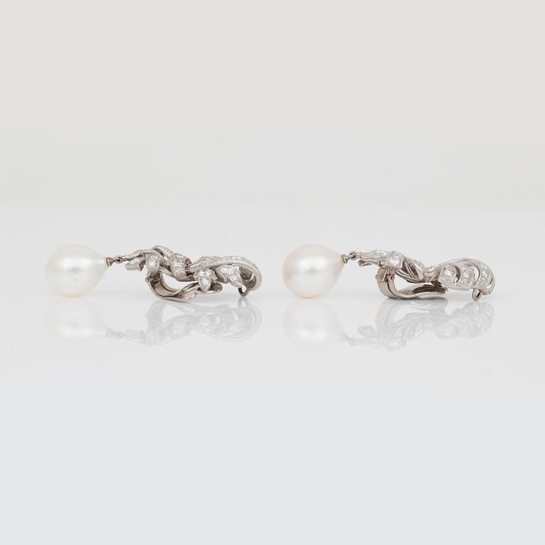 A pair of cultured pearl and diamond earrings.