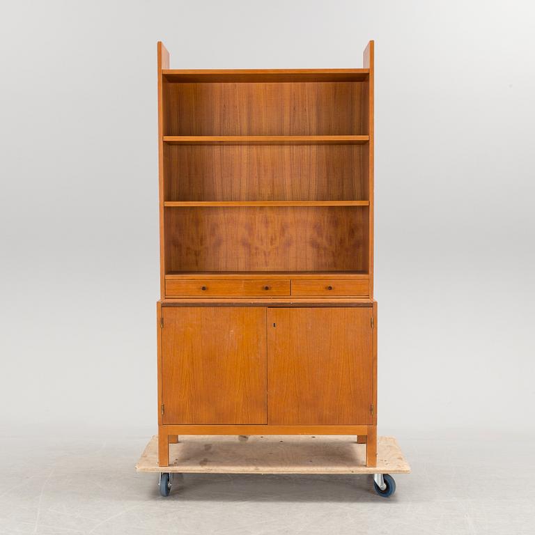 A teak vaneered book case, 1950's/60's.