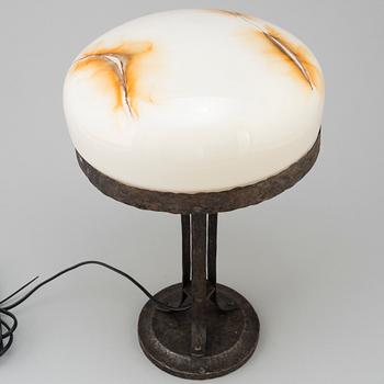 A wrought iron table light, early 20th Century.