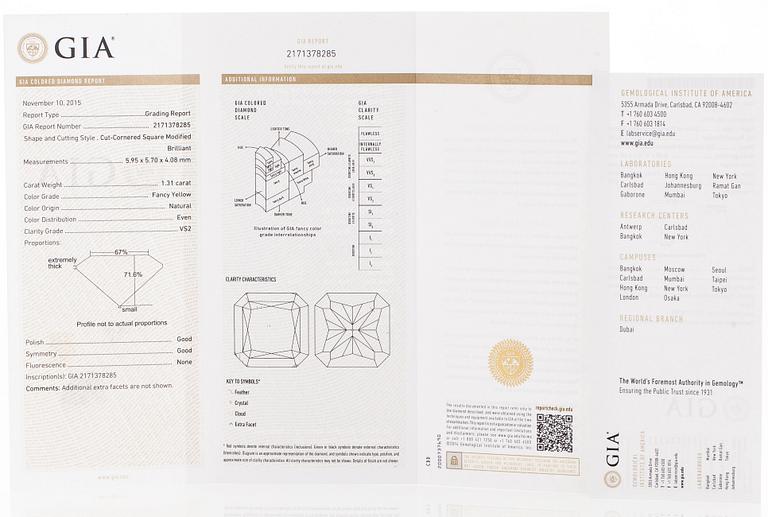 platinum ring with yellow radiant-cut diamond and brilliant cut diamonds.