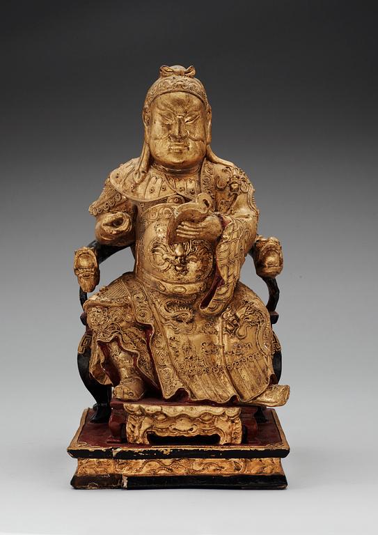 A wooden, gilt and lacquered figure of an chinese general, Qing dynasty, presumably Qianlong (1736-95).