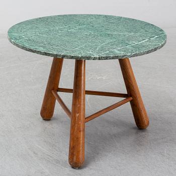 A late 20th century stone and wood coffee table.