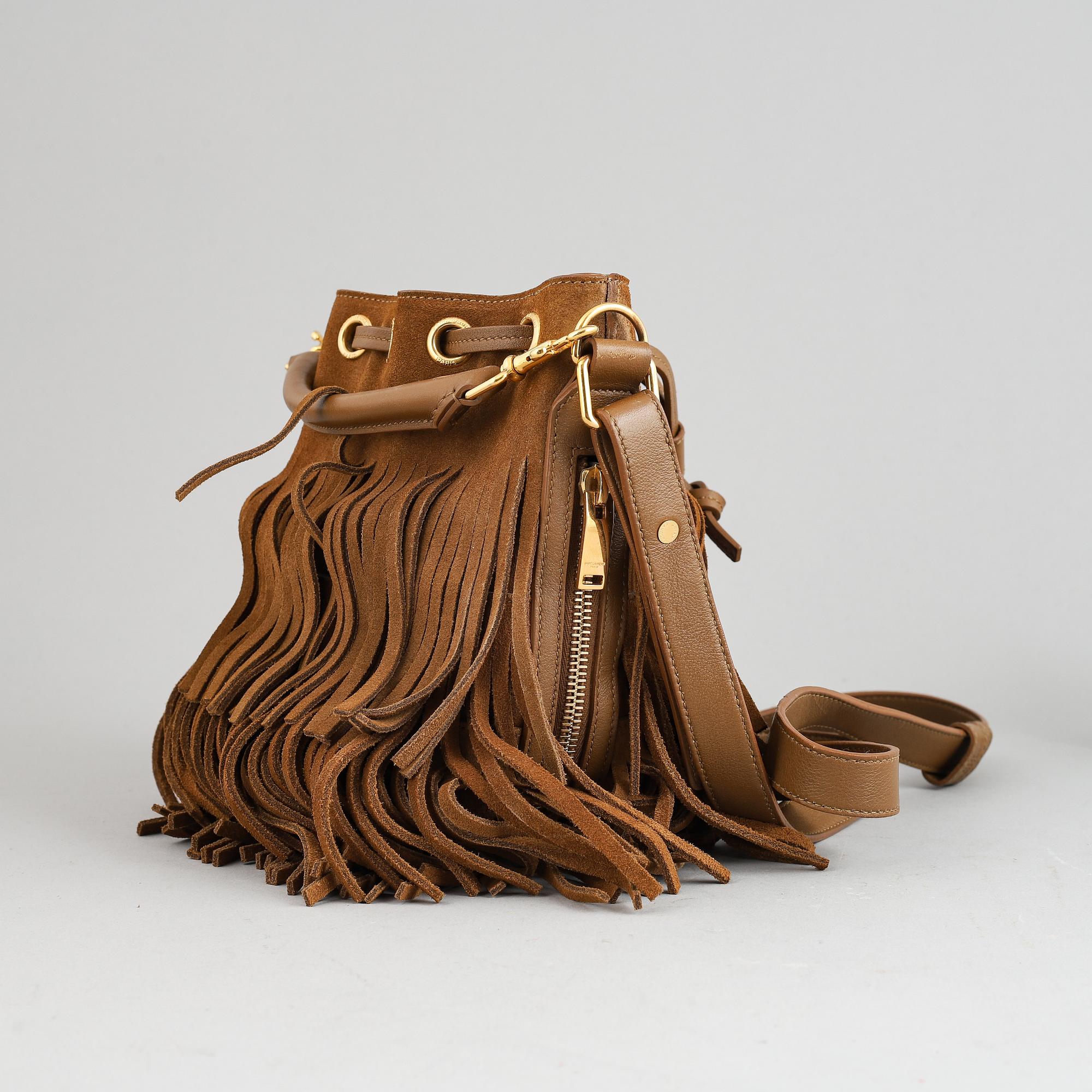 Yves Saint Laurent, a suede fringe handbag.