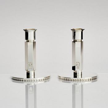Wiwen Nilsson, a pair of sterling silver candlesticks, Lund, Sweden 11957 and 1960.