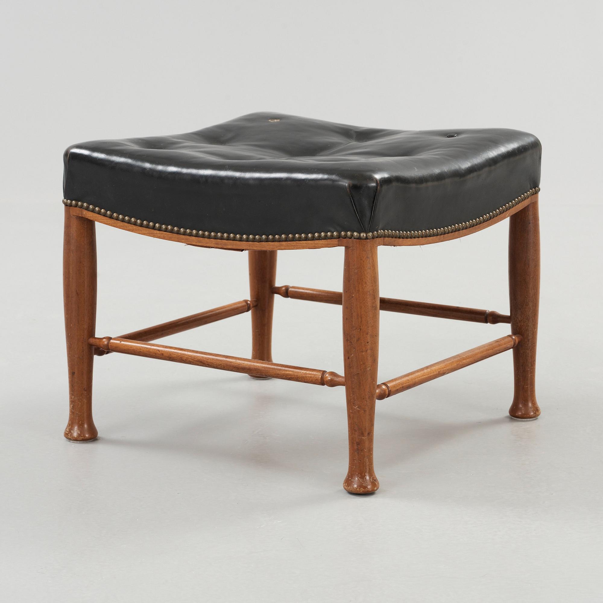 A Josef Frank mahogany and black leather stool, Svenskt Tenn, model 902.