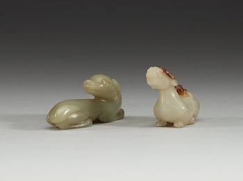 Two Chinese carved nephrite figures of a ram and a reclining dog.