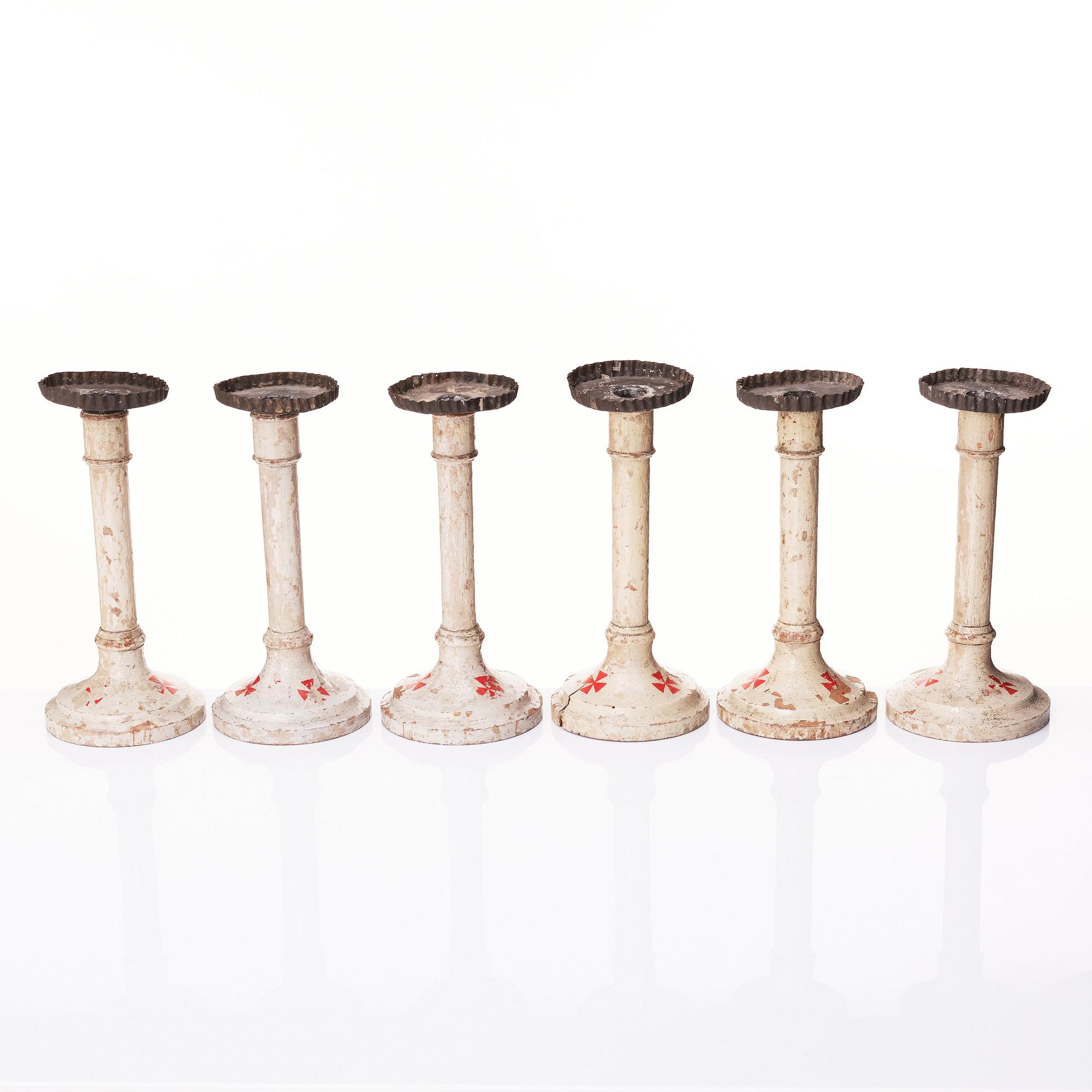 A set of six Empire wooden candlesticks, early 19th century.