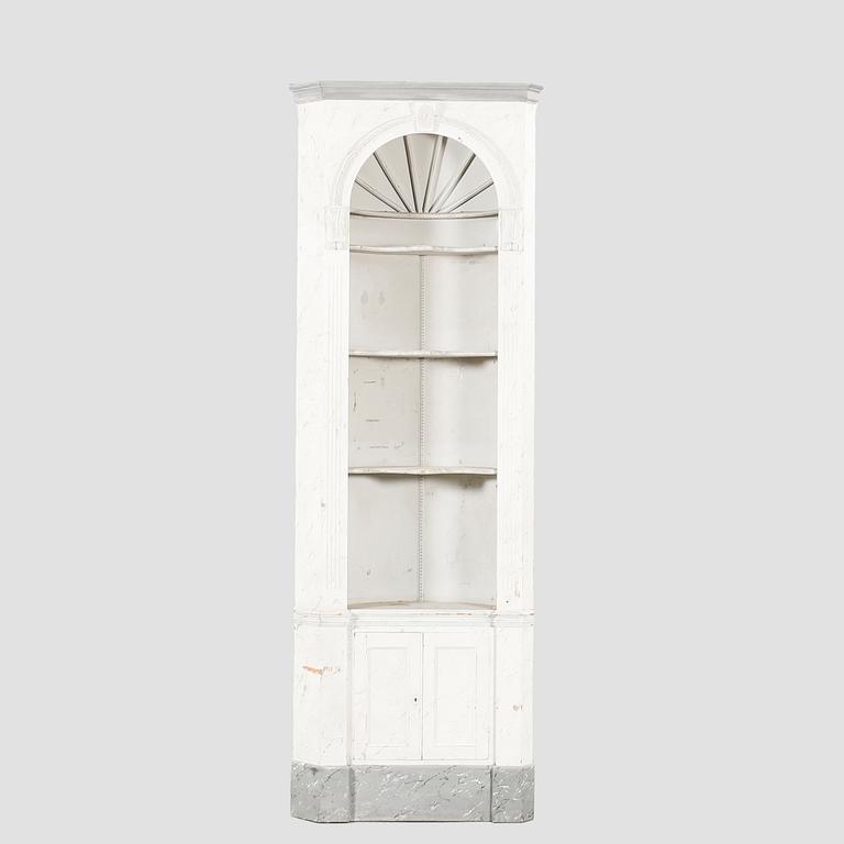 A painted Louis XVI style wallmounted corner cabinet.