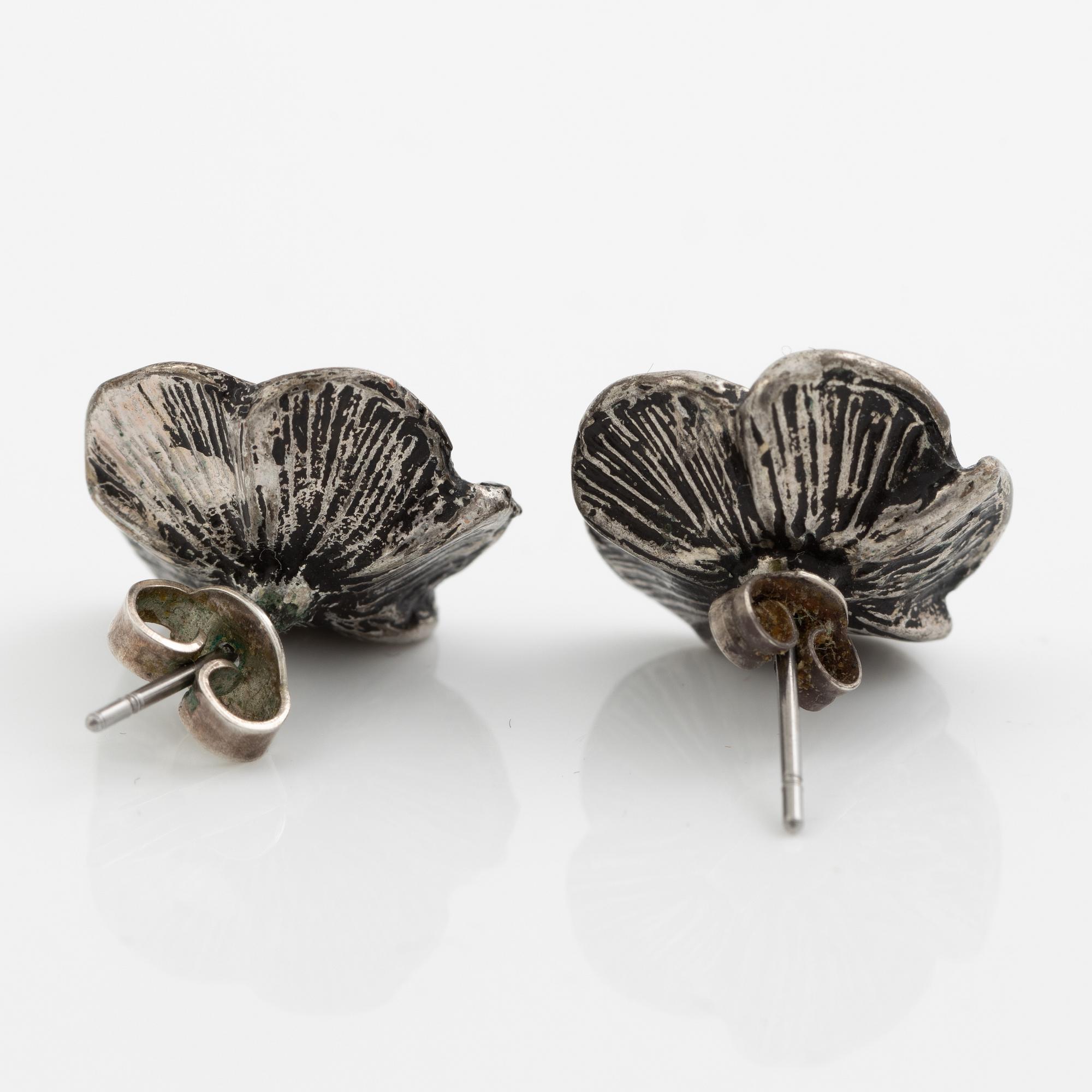 Necklace with matching earrings, white metal in floral design with glass stones.