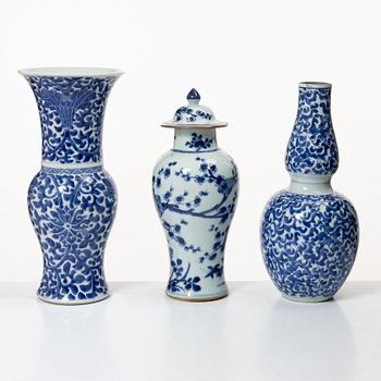 Two blue and white vases, Qing dynasty, 19th century and a blue and white vase with cover, 18th century.