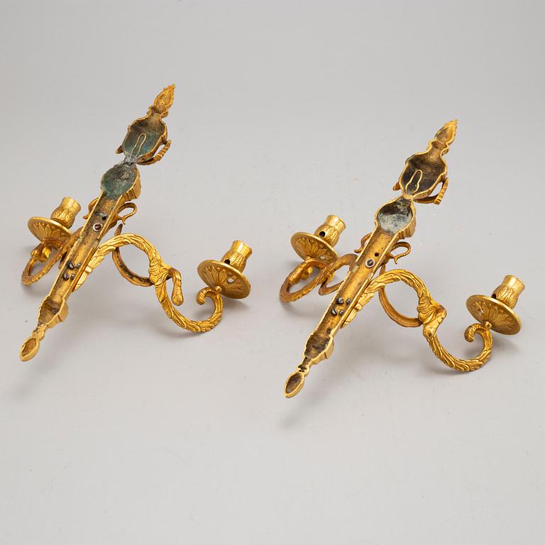 A pair of wall sconces, Louis XVI style, early 20th century.