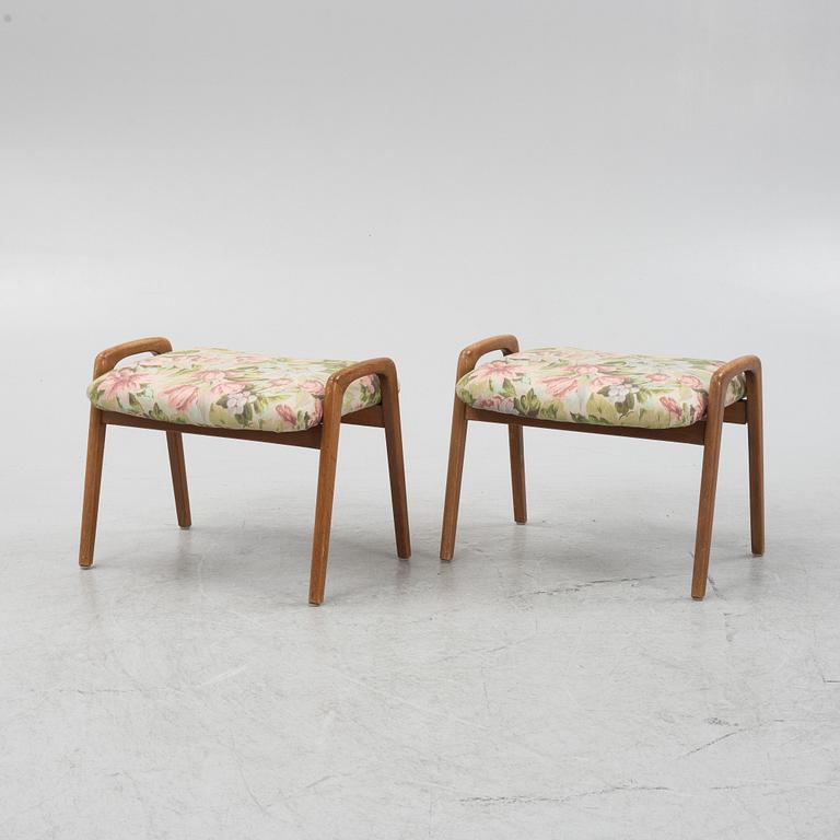 A pair of ottomans, 20th century.