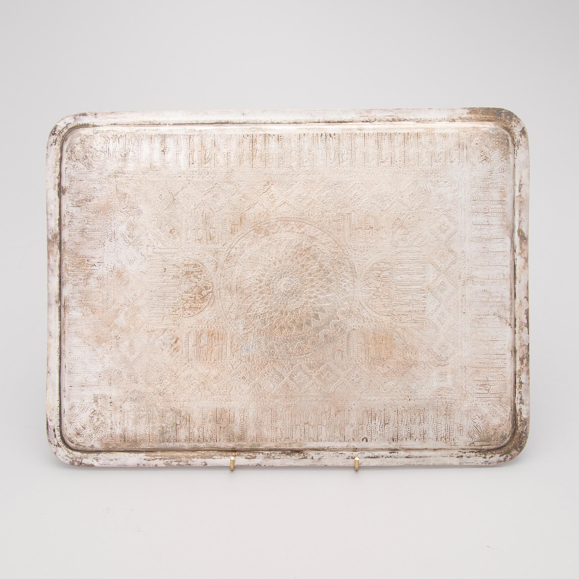 A Persian silver tray, mark of Vaspour, silver mark 84.
