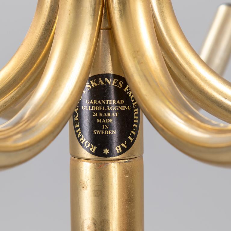 TAMBURMAJOR, guldpläterad metal, Rörmekano. Skånes Fagerhult, Sverige. 1970 / 80-tal.