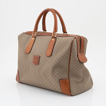 Céline, a macadam-canvas bag.