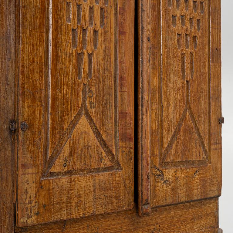 An early 19th Century provincial corner cabinet.