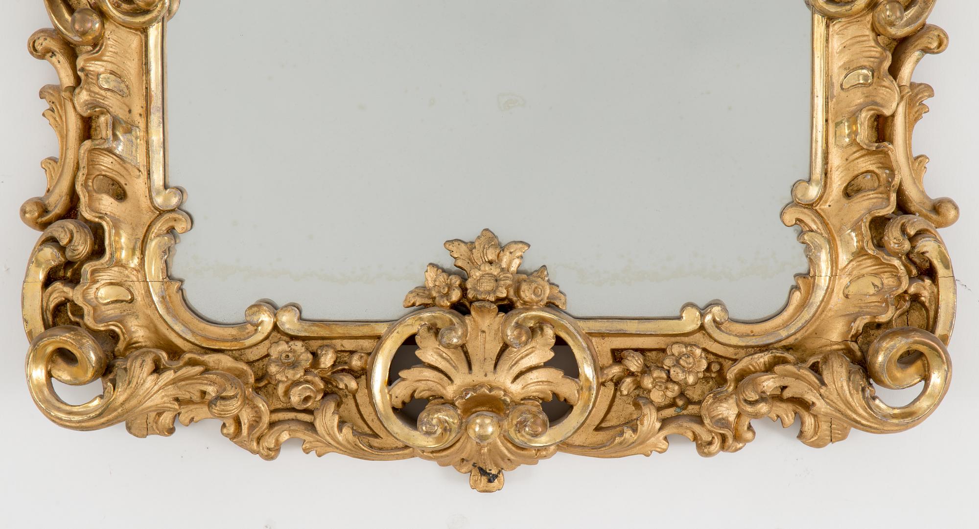 A late 19th century rococo style mirror abd console table.