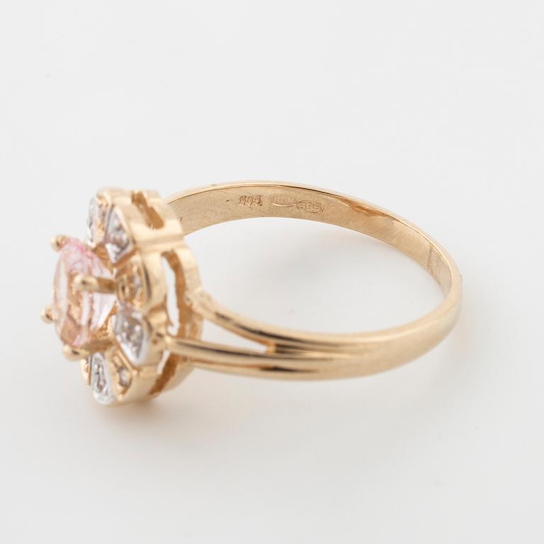 A morganite and brilliant cut diamond ring.