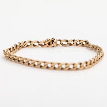 A 14K gold bracelet.