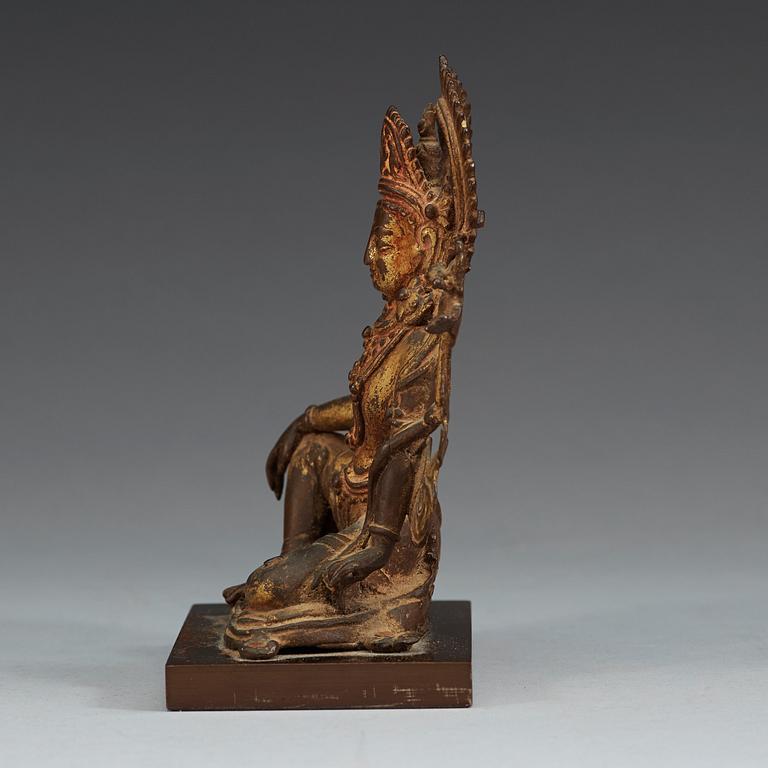 A gilt bronze figure of Indra, Nepal, 18th Century or older.