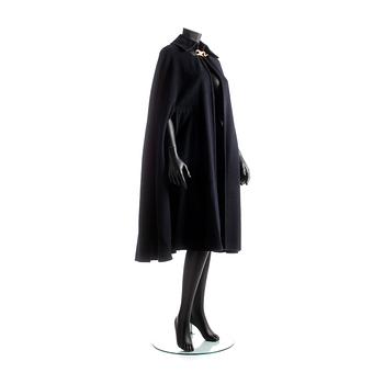 CÉLINE, a dark blue wool blend cape.