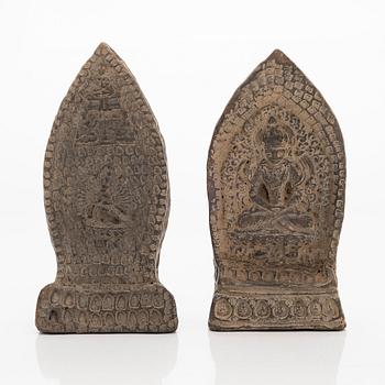 Two steles/tsa tsas, presumably circa 1900.