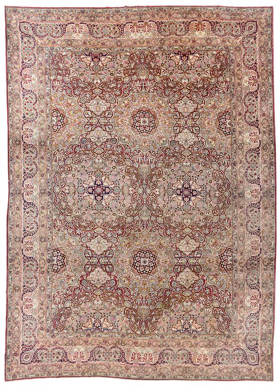 An antique Kerman Laver carpet, south east persia, ca 501 x 359 cm.