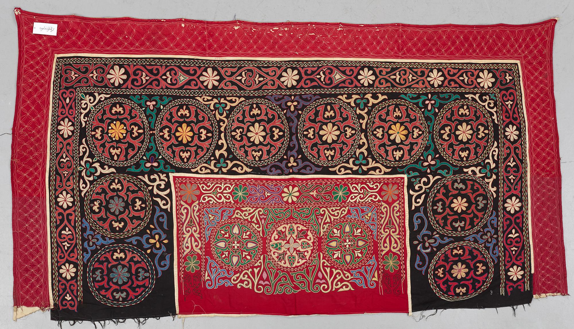 A Suzani textile, ca 247 x 128 cm.