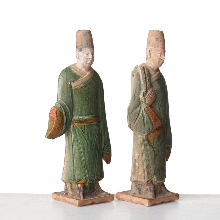 Two green and yellow glazed pottery figures of Ming officials, Ming style, 20th Century.