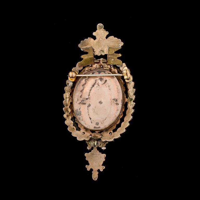 MEDALJONGBROSCH / -HÄNGE, metall och granater, 1800-talets slut.