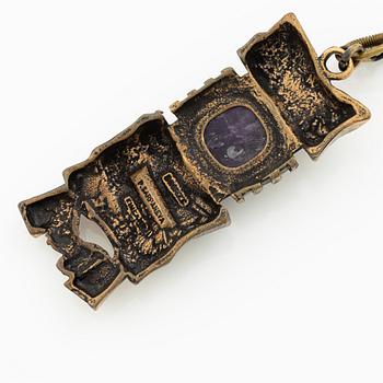 Pentti Sarpaneva, A bracelet, a pair of earrings, a ring, and a pendant, bronze with amethyst, Finland 1960s.
