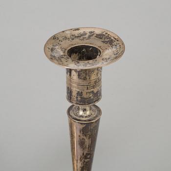 A pair of empire silver candles, presumably Stockholm, dated 1819.