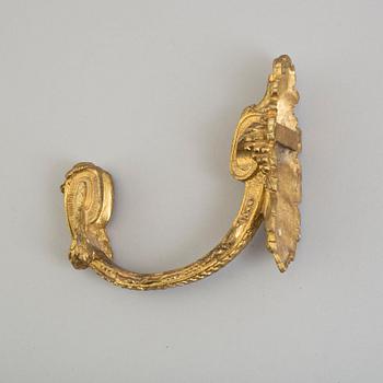 Four 19th century bronze tie-backs.