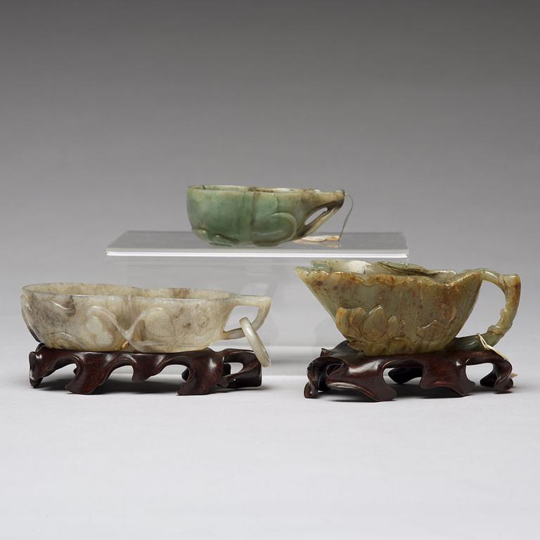 A Chinese group of three sculptured cups.