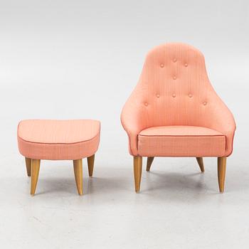 Kerstin Hörlin-Holmquist, a 'Lilla Eva' armchair with foot stool, Nordiska Kompaniet, Sweden, mid 20th century.