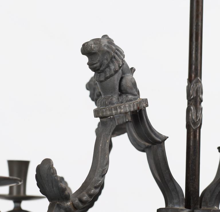 A pewter chandelier, in parts attributed to Anna Petrus, for four candles executed by Firma Svenskt Tenn in 1927.