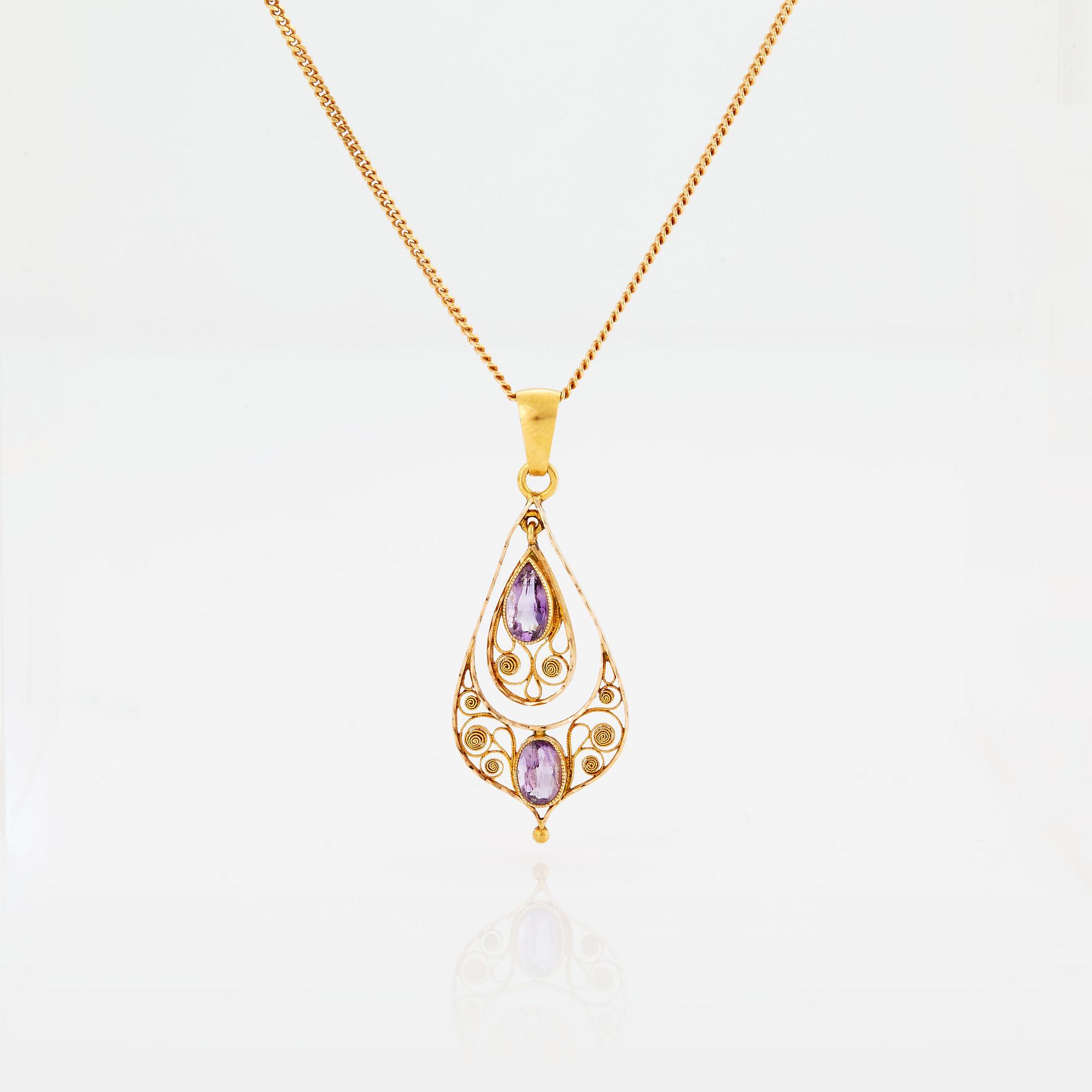 A PENDANT set with amethysts.