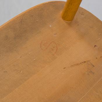 Seven matched mid 20th Century birch and beech chairs.